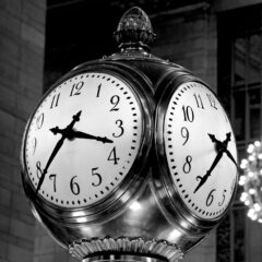 Black and white image of the famous Grand Central Terminal clock in New York City.